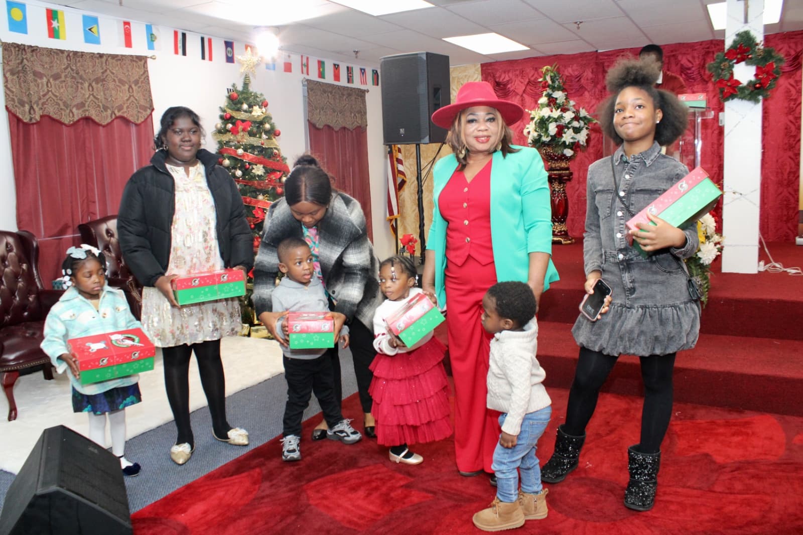 Child opening gifts at a Toy Drive celebration